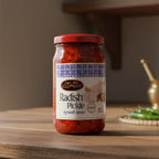 Jar of radish pickle with a red lid on a gray background