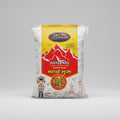 Packaged puffed rice with a yellow and red label featuring mountain design and text.
