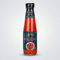 Bottle of Akbare Hot Sauce with a visible brand logo on a white background
