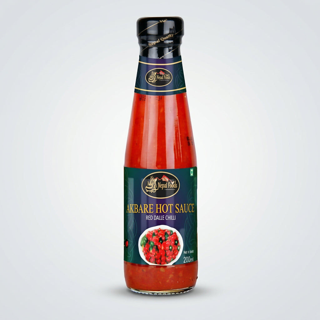 Bottle of Akbare Hot Sauce with a visible brand logo on a white background