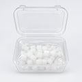 Two clear plastic storage containers with lids, one open and showing small white cube-shaped items inside, photographed on a light neutral background.
