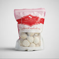 Packaged momo with a visible brand label on a white background