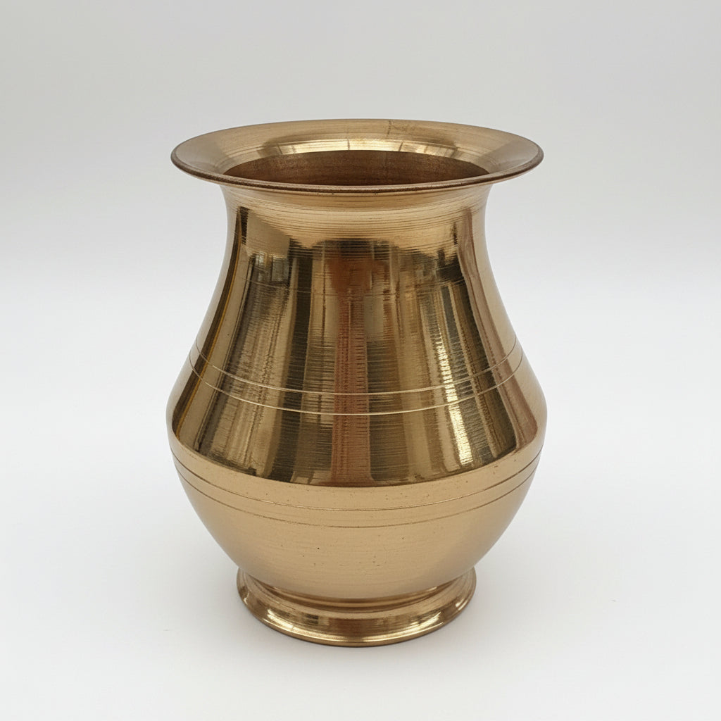 Gold vase with ribbed texture on a white background