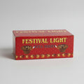 Box of festival lights labeled 'FESTIVAL LIGHT DIYA SERIES' with a red background and images of candle holders.