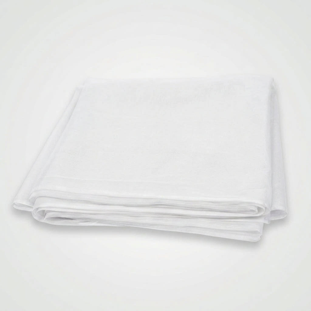 A folded bright yellow fabric item, likely a tablecloth or sheet, shown on a plain white background.