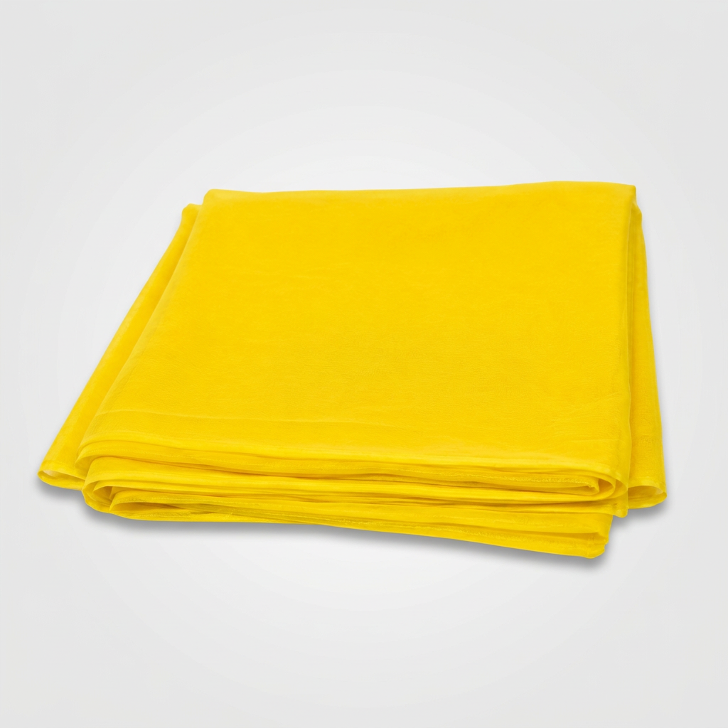A folded bright yellow fabric item, likely a tablecloth or sheet, shown on a plain white background.