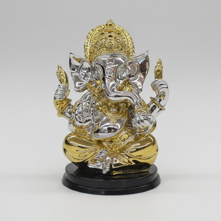 Decorative motorcycle figurine in gold and silver on a white background