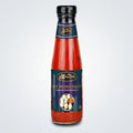 Bottle of Hot Momo Sauce with a blue label on a white background