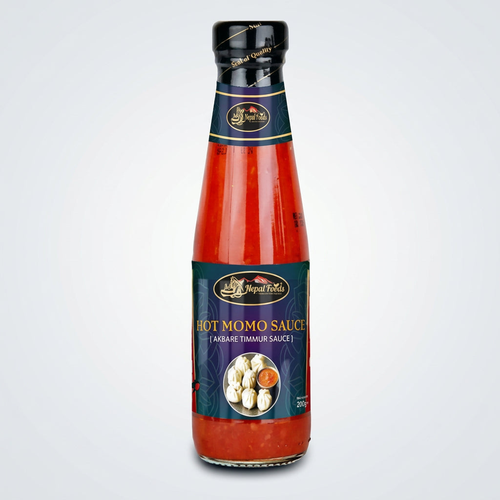 Bottle of Hot Momo Sauce with a blue label on a white background