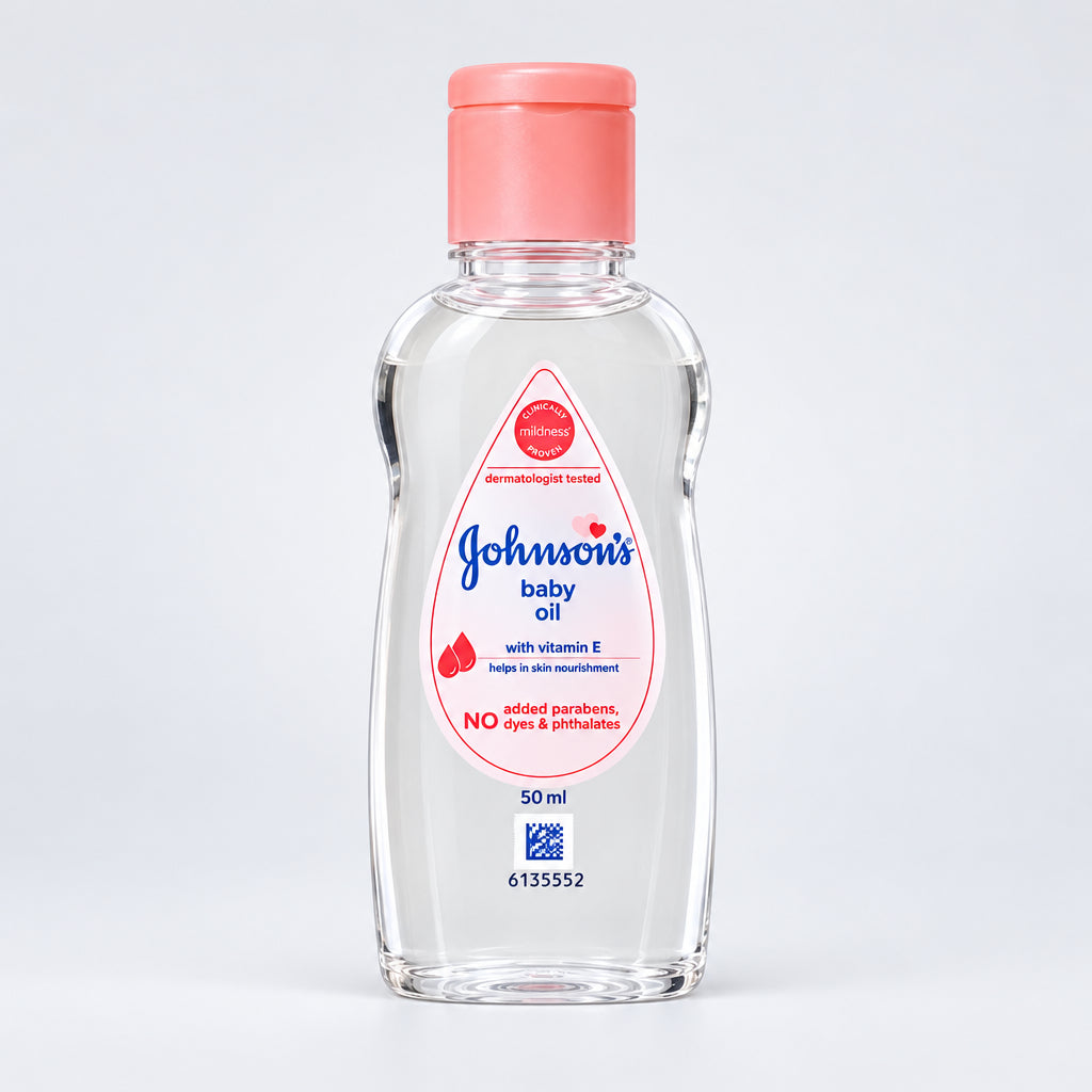 Johnson's baby oil bottle with pink cap on a white surface and light gray background