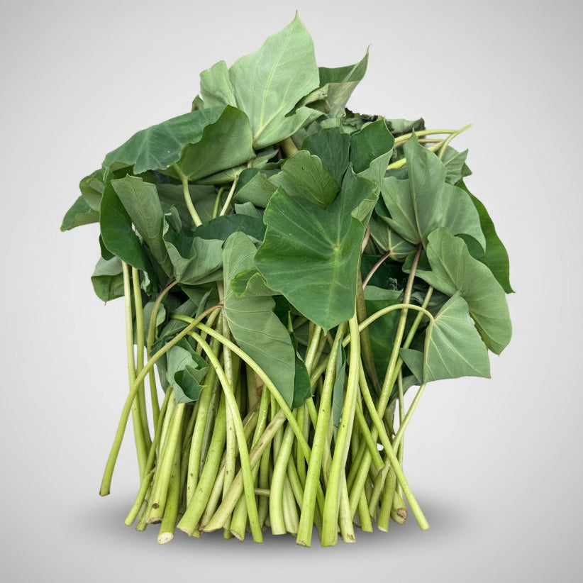 Bundle of green leafy vegetables on a white background