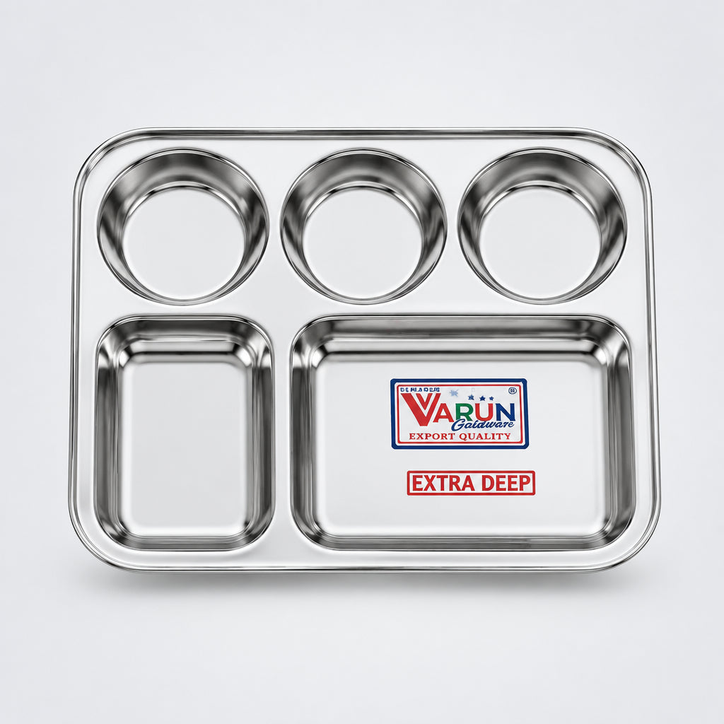 A rectangular stainless steel dinnerware set with multiple compartments, branded by VARUN, displayed on a white background with a small potted plant to the side.