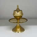 Brass candlestick holder on a white background