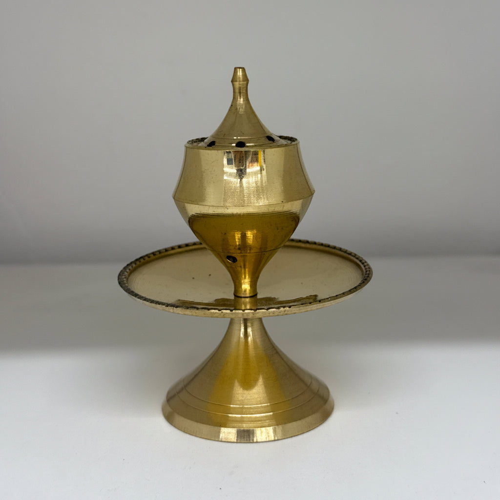 Brass candlestick holder on a white background