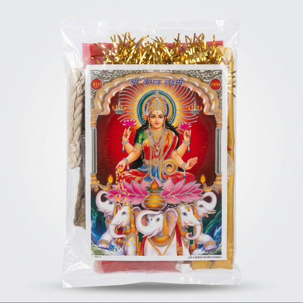 A packaged religious art print featuring a colorful illustration of a Hindu goddess seated on a pink lotus with elephants, wrapped in a clear plastic bag with gold tinsel trim and a rope visible on the left.