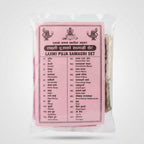 A packaged set of traditional Indian massage towels labeled 'LAXMI PUJA SAMAGRI SET' in Hindi, shown in a clear plastic bag with a pink printed card insert.