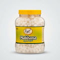 A 500g jar of Royal Premium Makhana (Chow Chutney) with a bright yellow lid and a yellow label, containing white fluffy makhana pieces, on a white background.