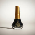 Black eye liner with gold cap on a white background