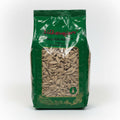 Green package of sunflower seeds with visible brand name on a white background
