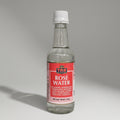 Bottle of TRS Rose Water on a metallic surface