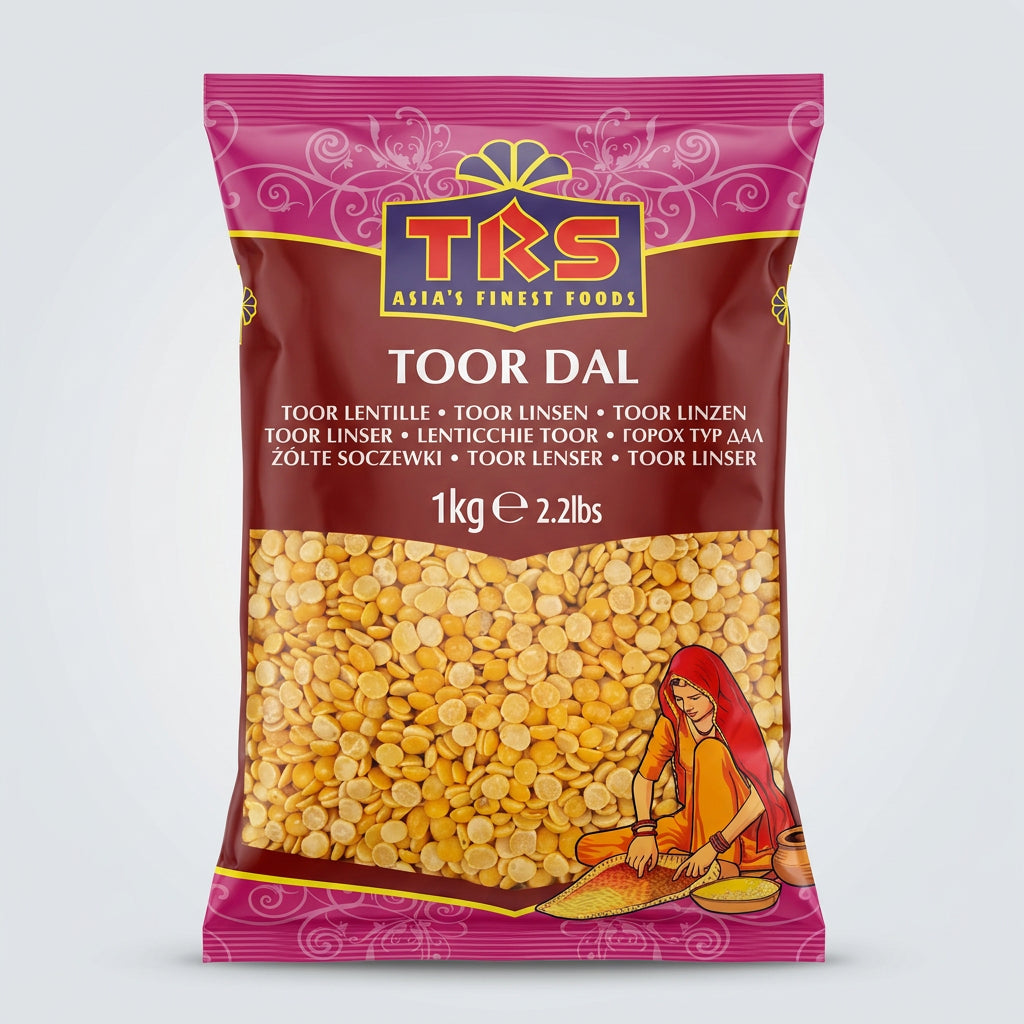 A package of TRS Toor Dal weighing 1kg. The packaging is primarily pink and yellow with an image of the dal seeds and some decorative patterns.
