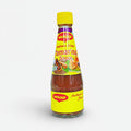 A bottle of Maggi Tamarind Sauce with a yellow label on a white background.