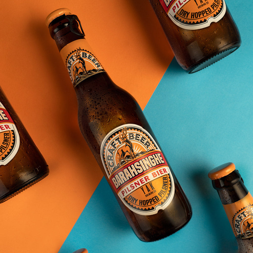 Braainsinghe beer bottles on a colorful background