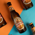 Braainsinghe beer bottles on a colorful background