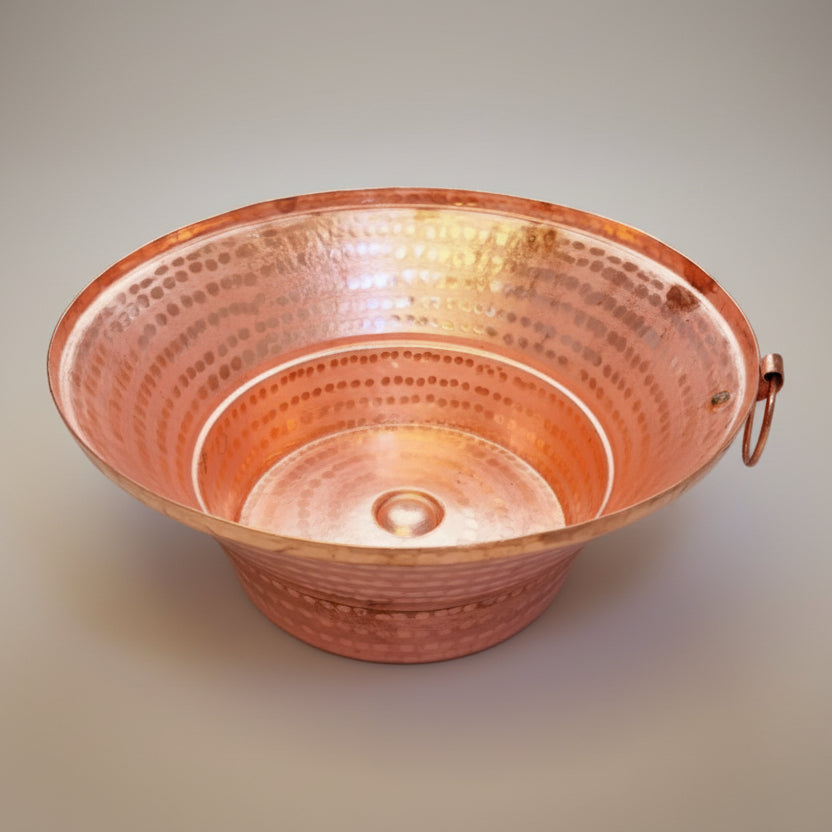 A copper pathi with a hammer textured surface, displayed against a white background.