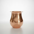 A copper-colored metal lota (vase) displayed against a neutral background.