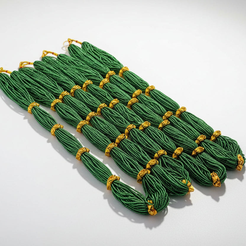 A set of green traditional Nepalese naugadi with yellow decorative elements, displayed against a white background with a watermark/logo in the bottom right corner.