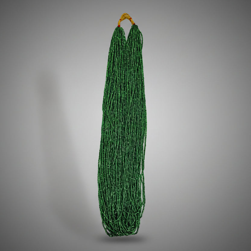 A green beaded necklace displayed against a white background, hanging vertically.