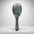 Metallic spoon-like object on a gray background