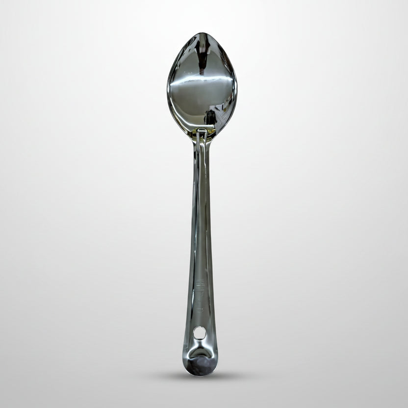 Silver spoon on a light gray background