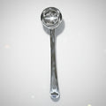 Metallic ladle on a white background
