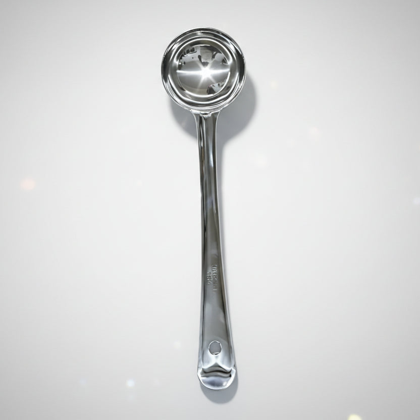 Metallic ladle on a white background