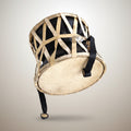 Traditional drum with woven design on a white background