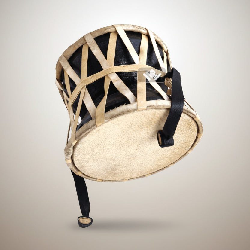 Traditional drum with woven design on a white background