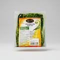 Packaged fiddlehead ferns with a label on a white background