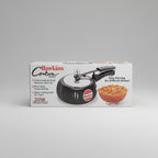 Hawkins Contura Black pressure cooker packaging with a bowl of food on a white background