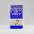 A 5kg bag of Kainaat 1121 Basmati Extra Long Rice, with a predominantly blue color scheme and decorative patterns