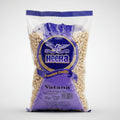 Bag of Heera Vatana whole yellow peas on a white background