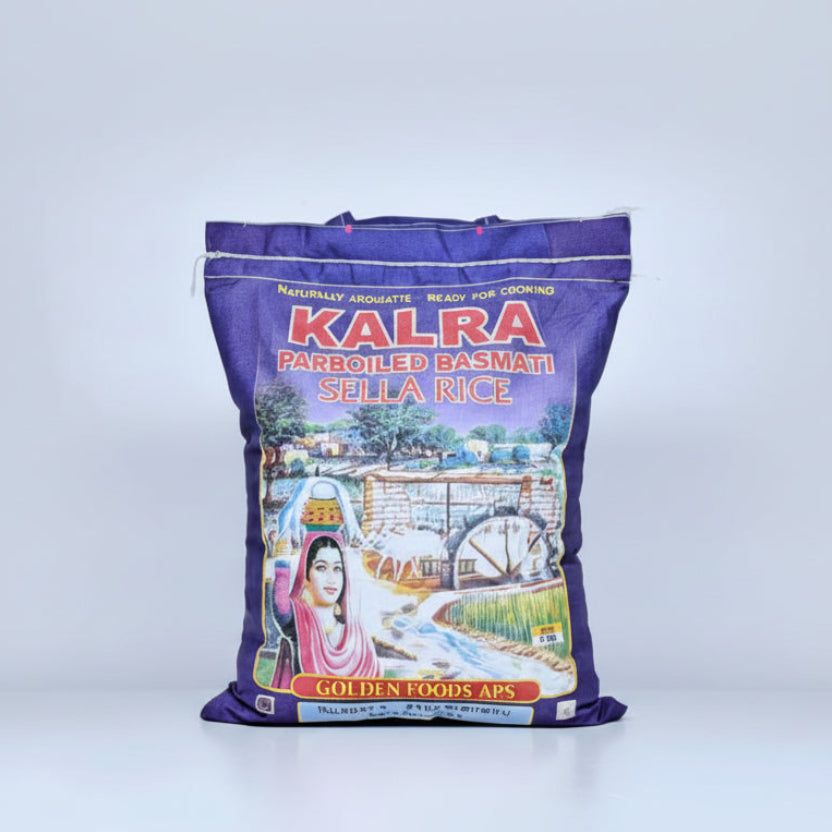 A 5kg bag of Kalra Sella Rice with a printed picture of a woman on the front.