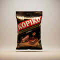 A package of Kopiko coffee hard candy, 175g/50stk, with a picture of the black candy pieces on a white background.