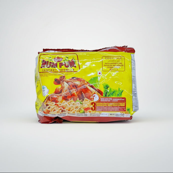 Packaged instant noodles with a yellow and red label on a white background