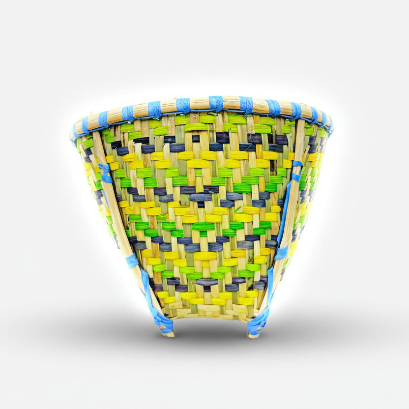 Woven basket with colorful pattern on a white background