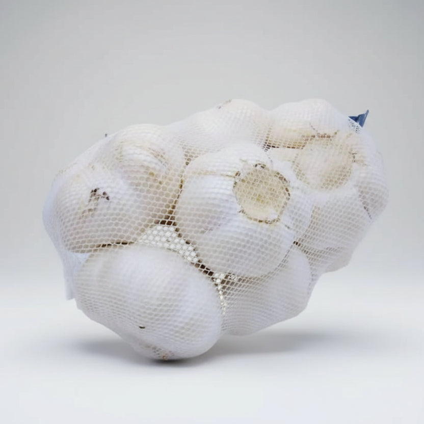 A netted bag containing several bulbs of garlic.