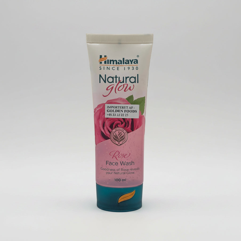 Himalaya Natural Glow Rose Face Wash tube on a shelf with a blurred store background