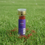 Spice container with 'High Quality Safran' label on a white box in a store setting