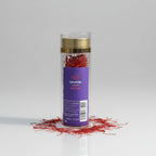 Spice container labeled 'Spicefully' with saffron on grass